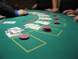 Live baccarat table at fanta555 Indonesia Open studio showing dealer, cards, and betting layout clearly